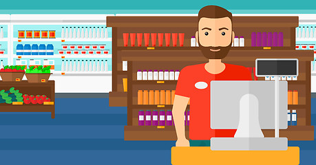 Image showing Salesman standing  at checkout.