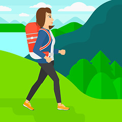 Image showing Woman with backpack hiking.