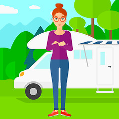 Image showing Woman standing in front of motor home.