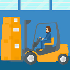 Image showing Warehouse worker moving load by forklift truck.