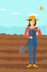 Image showing Farmer on the field with shovel.
