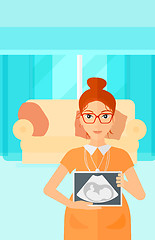 Image showing Pregnant woman with ultrasound image.