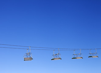 Image showing Ski-lift and blue clear sky