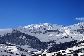 Image showing Snowy sunlight mountains at sun morning