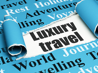 Image showing Tourism concept: black text Luxury Travel under the piece of  torn paper