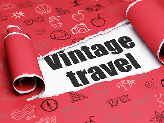 Image showing Travel concept: black text Vintage Travel under the piece of  torn paper