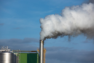 Image showing Steaming Pipe on Blue Sky Background