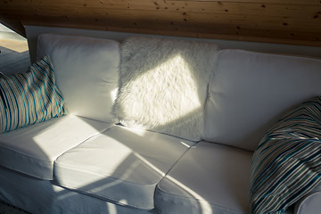 Image showing Sunbeam Falls on a White Sofa