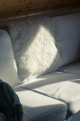 Image showing Sunbeam Falls on a White Sofa