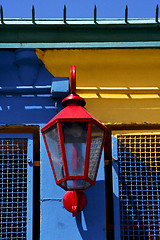 Image showing   lamp  and a colorated  wall in la boca buenos aires 