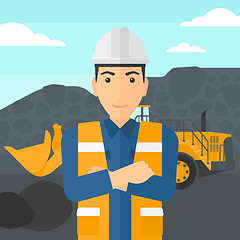 Image showing Miner with mining equipment on background.