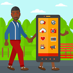 Image showing Man walking with smartphone.