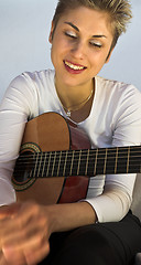 Image showing woman and guitar