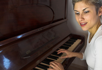 Image showing woman and piano