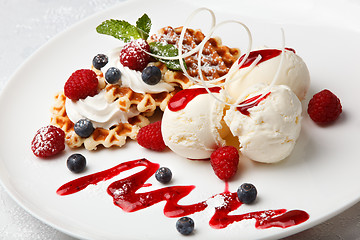 Image showing Vanilla ice cream and waffles with fresh berries