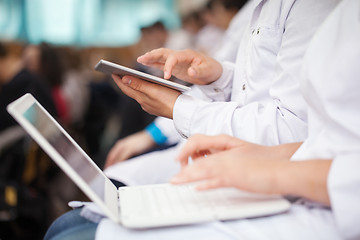 Image showing Medical students with pad and laptops in auditorium