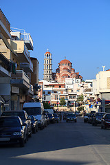 Image showing Narrow street with parked cars in Greece