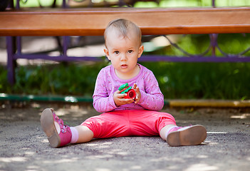 Image showing Small baby playing with toy