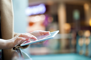 Image showing Woman with tablet computer in public place