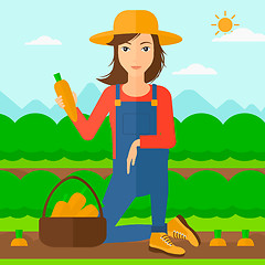 Image showing Farmer collecting carrots.