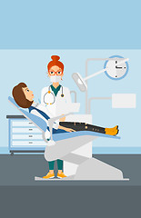 Image showing Dentist and woman in dentist chair.