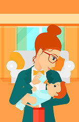 Image showing Woman feeding baby.