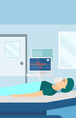 Image showing Patient lying in hospital bed with heart monitor.