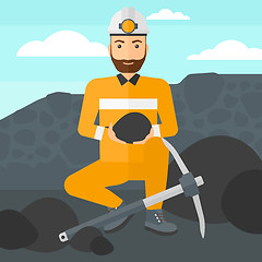 Image showing Miner holding coal in hands.