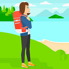 Image showing Woman with backpack hiking.