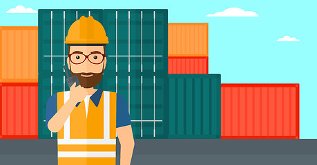 Image showing Stevedore standing on cargo containers background.