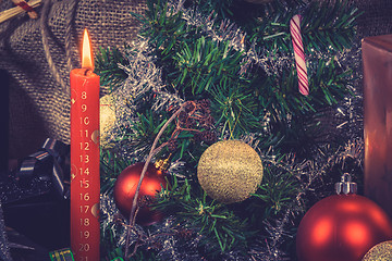 Image showing Red Christmas candle with a calendar