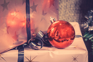 Image showing Christmas presents with a red baubel