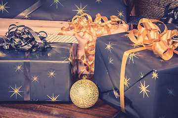 Image showing Presents with ribbons and a bauble