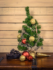 Image showing Shiny baubles under a Christmas tree