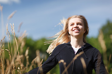 Image showing Young and happy girl in the field