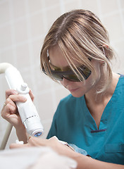 Image showing Facial treatment with laser in cosmetology clinic