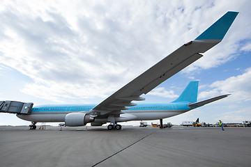 Image showing Modern airplane stands at the airport