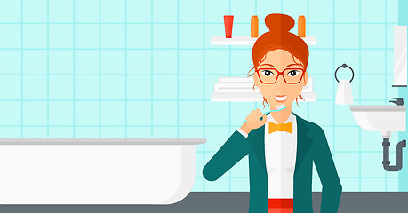 Image showing Woman brushing teeth.