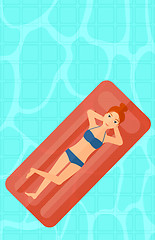 Image showing Woman relaxing in swimming pool.