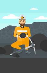 Image showing Miner holding coal in hands.