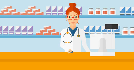 Image showing Pharmacist at counter with computer monitor.