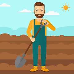 Image showing Farmer on the field with shovel.