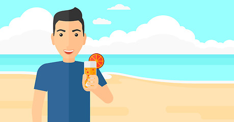 Image showing Tourist with cocktail on the beach.