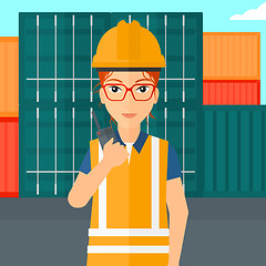 Image showing Stevedore standing on cargo containers background.