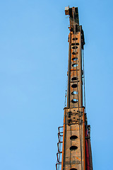 Image showing Piling machine isolated on blue background