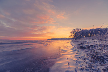 Image showing Beautiful sunrise at a frozen sea shore