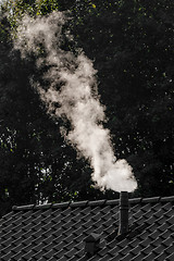 Image showing Smoking chimney on a house