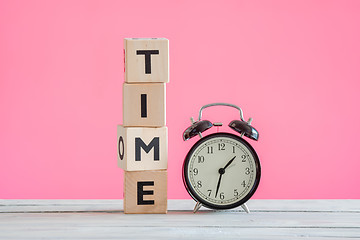 Image showing Alarm clock and cubes spelling time