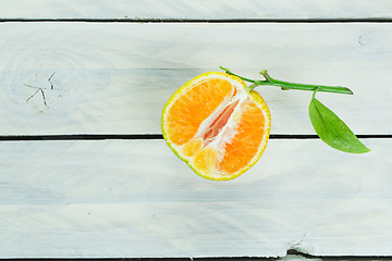 Image showing Citrus fruit on a wooden table