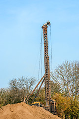 Image showing Industrial machine drilling holes